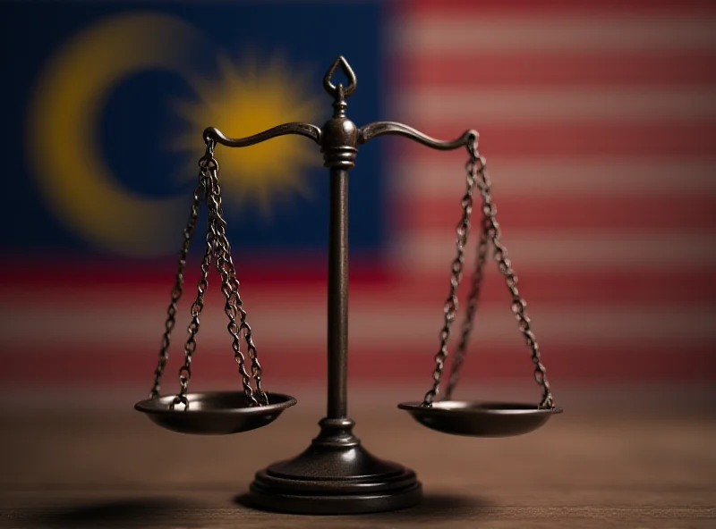 Conceptual image of scales of justice with the Malaysian flag in the background