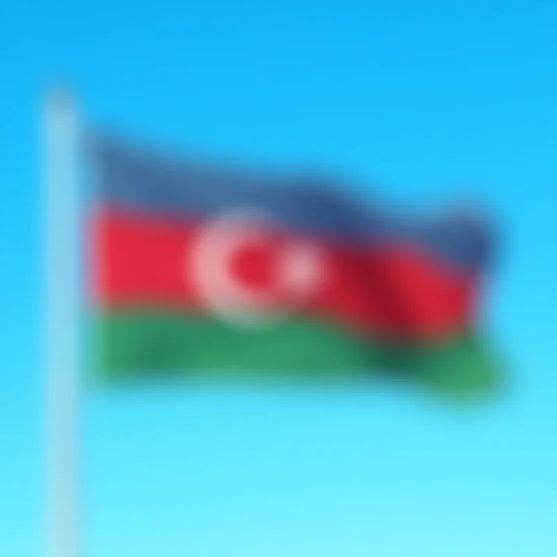 Azerbaijani flag waving in the wind, blue sky in the background