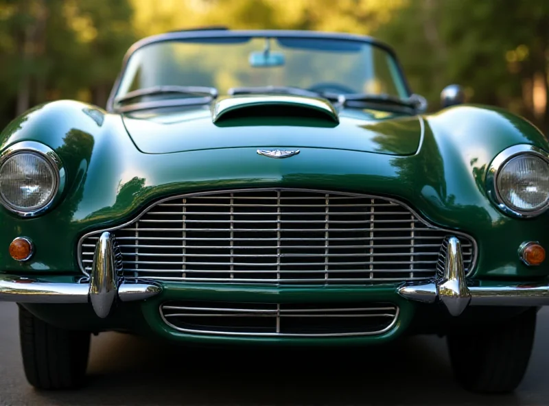 Close-up of a classic Aston Martin DB7, focusing on its sleek lines and iconic grill.