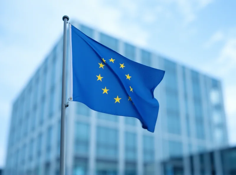 European Union flag waving in front of the European Council building in Brussels.