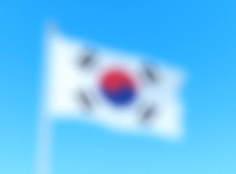 Image of the South Korean flag waving against a blue sky