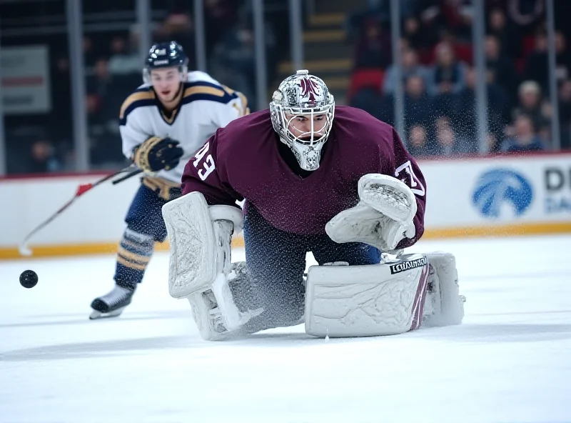 A high school hockey goalie making a save during a game.