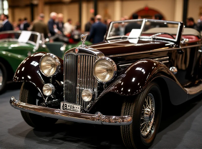 A beautifully restored Laurin & Klement vintage car on display at an auction.