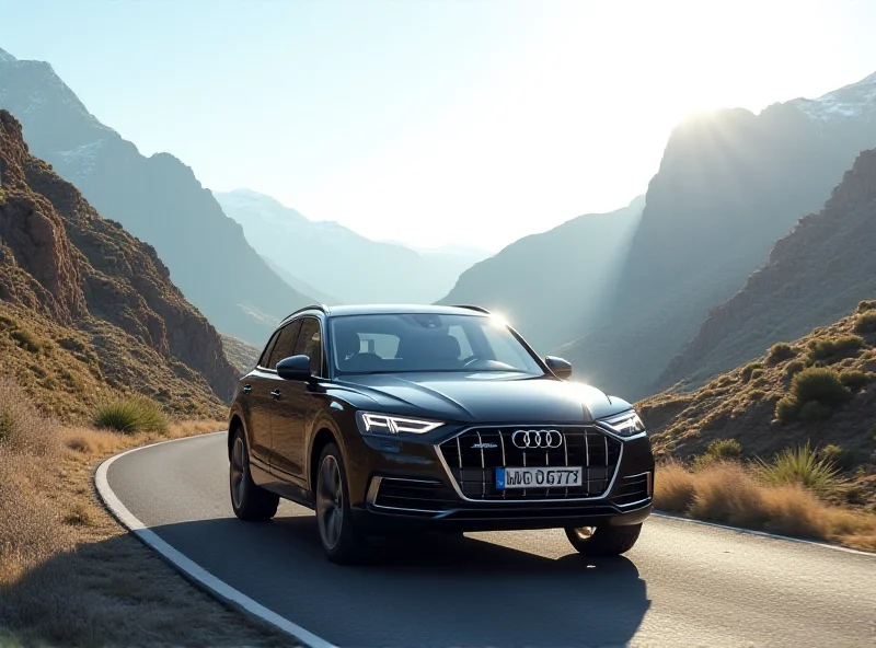 Modern Audi Q5 SUV driving on a scenic road