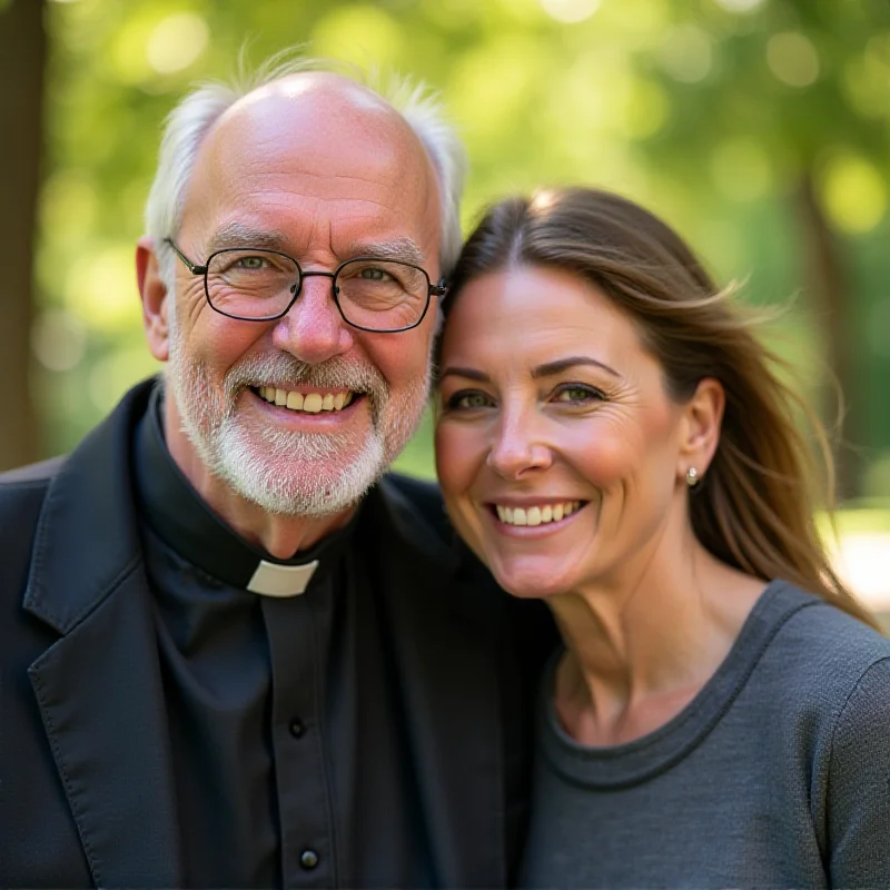 A smiling Krzysztof Dzienkowski, a Jesuit priest, posing for a photo with a woman. They are standing outdoors in a sunny location and appear friendly and relaxed. The image suggests a close relationship.