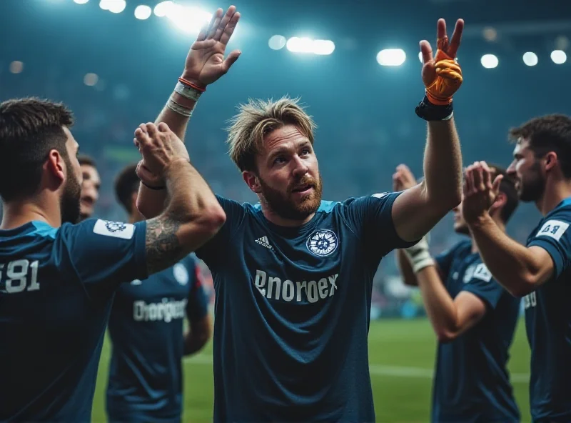 Loris Karius in Schalke 04 jersey celebrating with teammates after a late win
