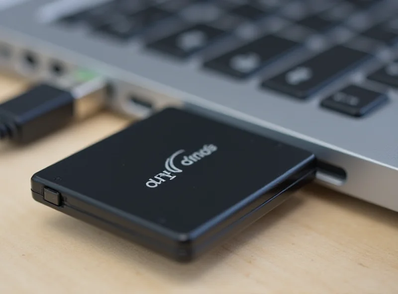 Seagate Ultra Compact SSD plugged into a laptop USB port