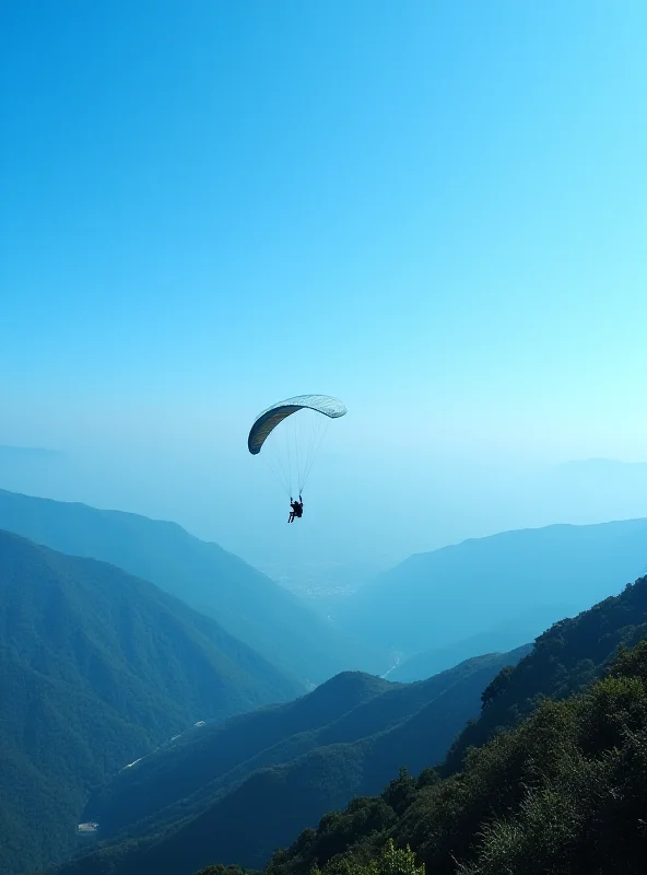 A paraglider soaring through the air against a backdrop of mountains and a clear blue sky, showcasing the beauty and risk of the sport.