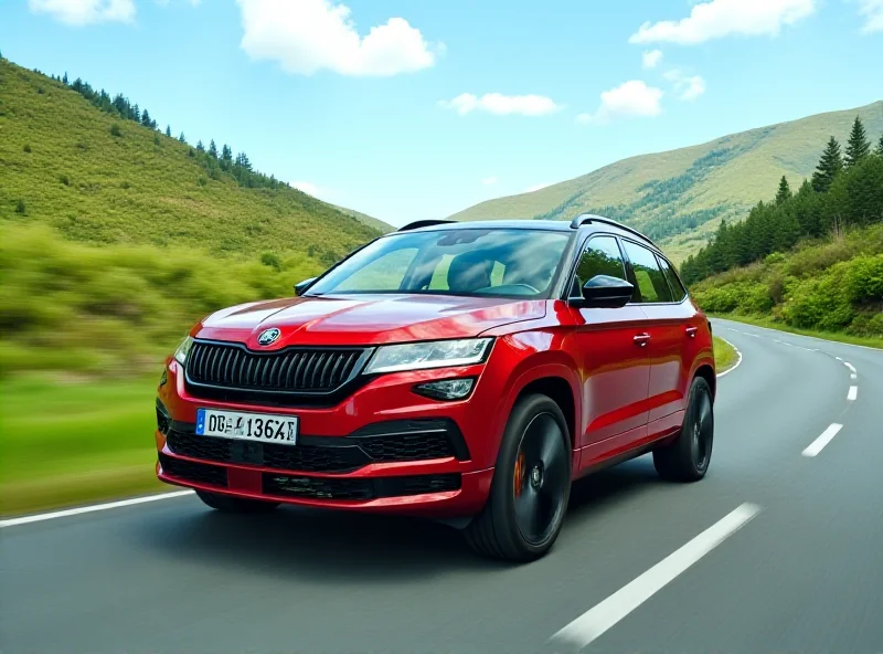 A red Skoda Kodiaq RS driving on a winding road through a green landscape.