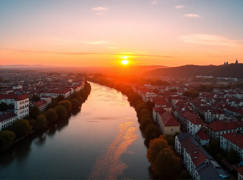 Panoramic view of Bratislava, Slovakia at sunset, with the Danube river flowing through the city.