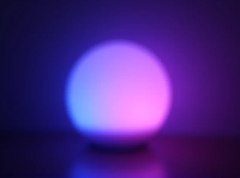 LIFX Luna smart lamp on a table, displaying a gradient of colors.