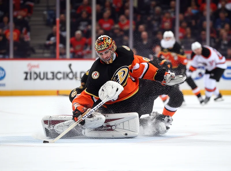 Anaheim Ducks goalie John Gibson making a behind-the-back save.