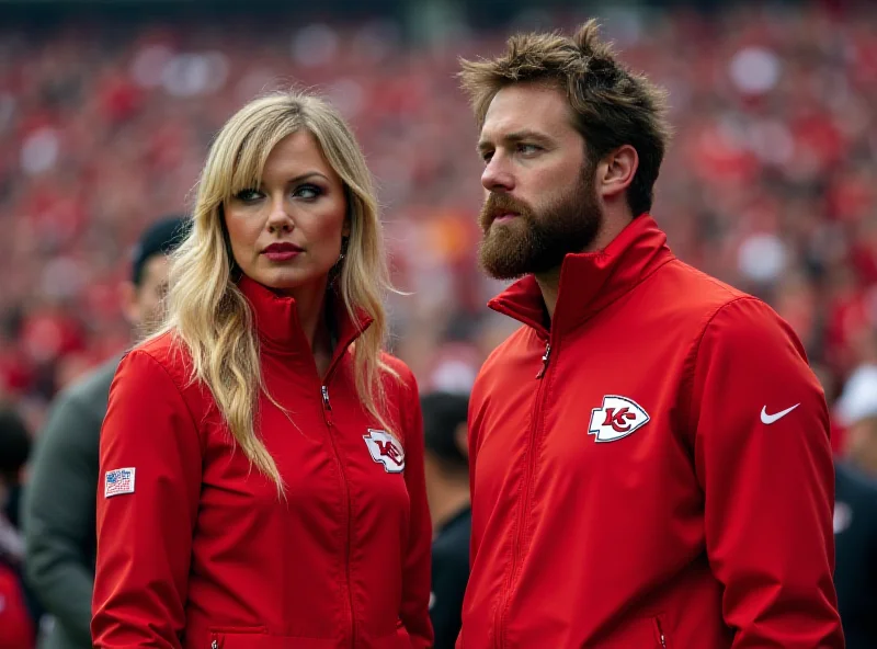 Taylor Swift and Travis Kelce on the sidelines at a football game.