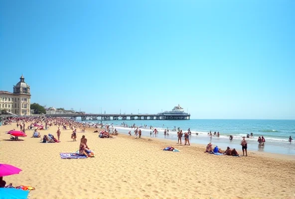 Bournemouth beach on a sunny day, with people enjoying the sand and sea
