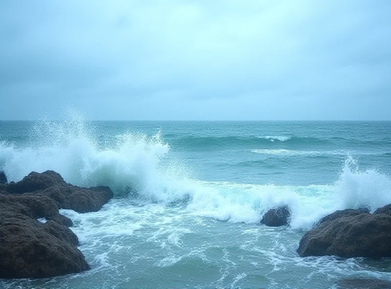 Waves crashing on a rocky shore, symbolizing the dangers of strong ocean currents.