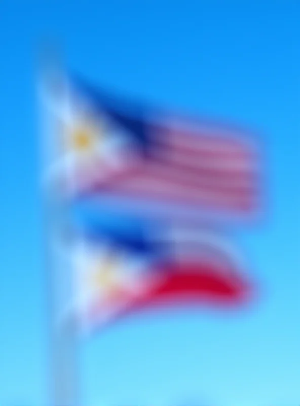 Image of the Philippine flag waving alongside the American flag.