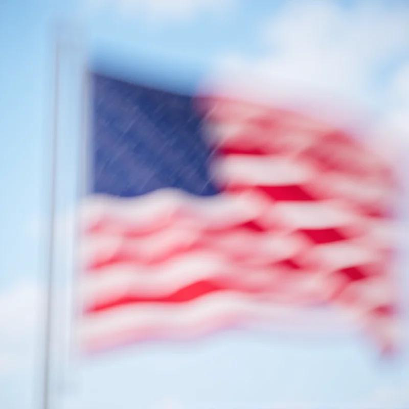 A close-up of the American flag waving in the wind.